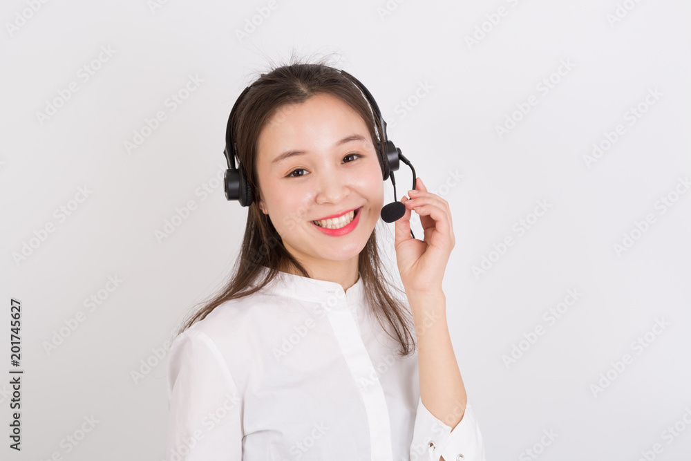 Portrait of female customer service representative wearing headset isolated over white background Portrait of female customer service representative wearing headset isolated over white background