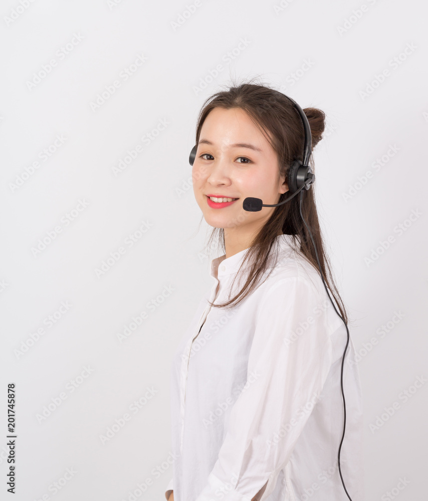 Portrait of female customer service representative wearing headset isolated over white background Portrait of female customer service representative wearing headset isolated over white background