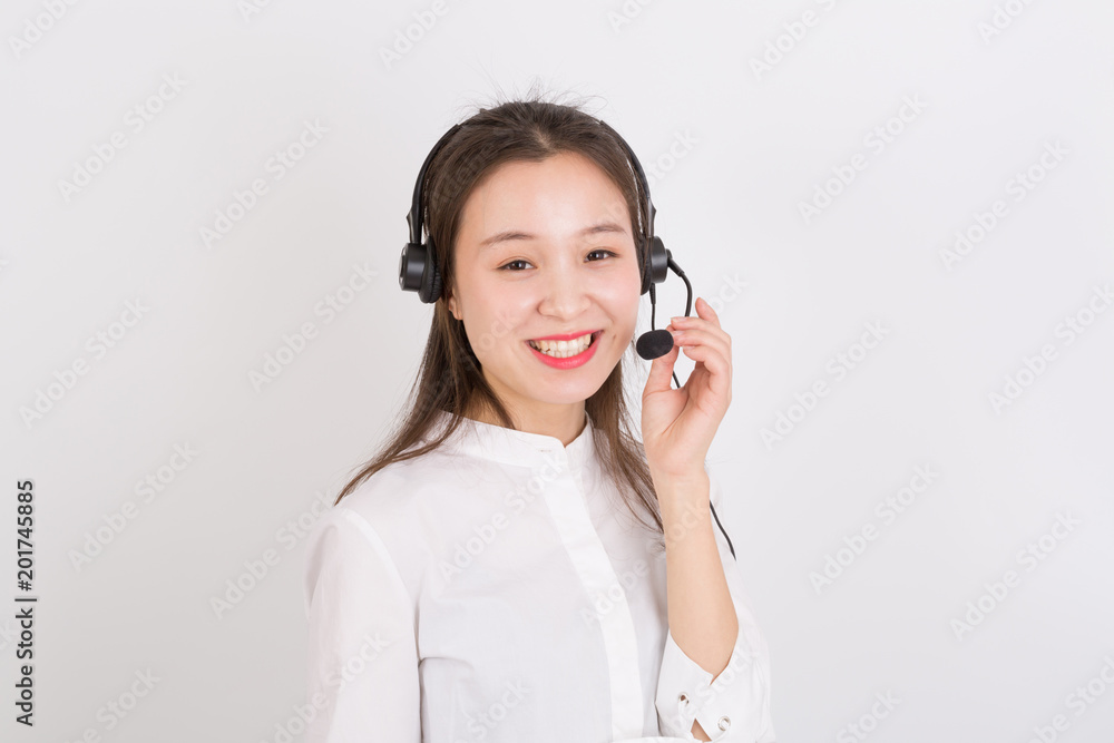 Portrait of female customer service representative wearing headset isolated over white background Portrait of female customer service representative wearing headset isolated over white background