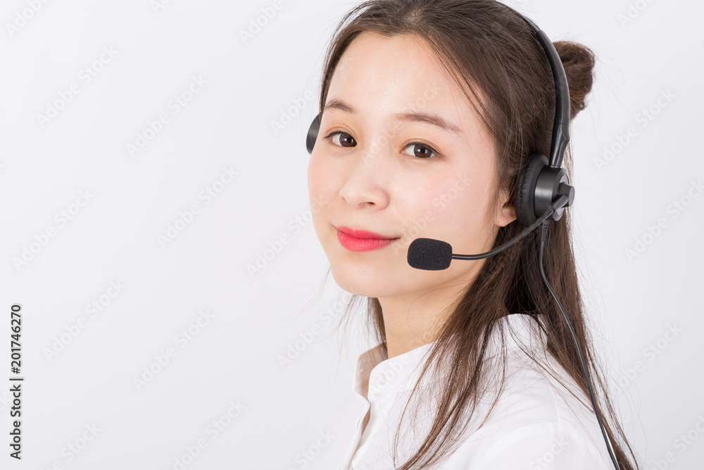 Portrait of female customer service representative wearing headset isolated over white background Portrait of female customer service representative wearing headset isolated over white background