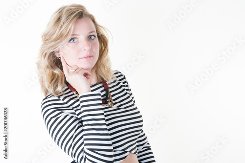 Pretty young charming blond woman close-up on a white background