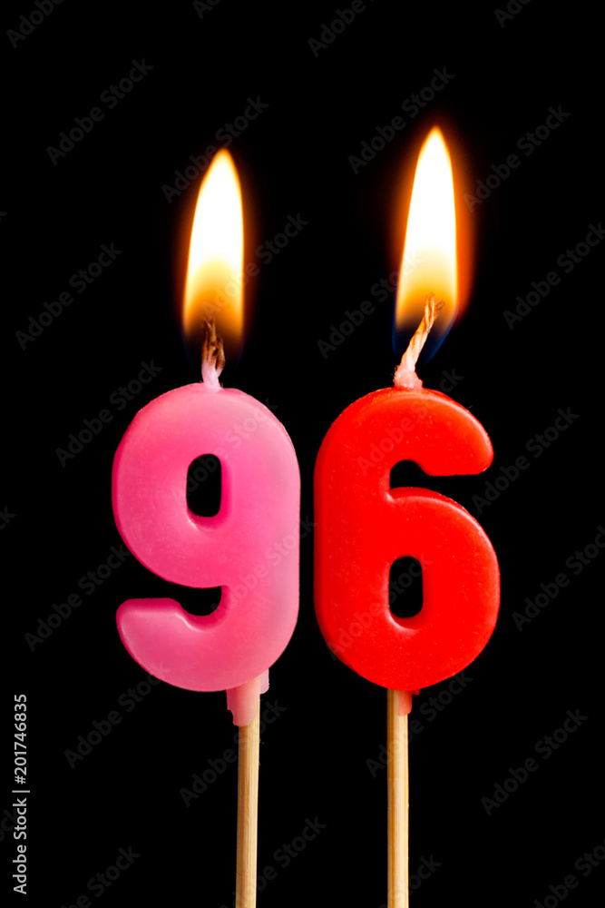 Burning candles in the form of 96 ninety six (numbers, dates) for cake isolated on black background. The concept of celebrating a birthday, anniversary, important date, holiday, table setting Burning candles in the form of 96 ninety six (numbers, dates) for cake isolated on black background. The concept of celebrating a birthday, anniversary, important date, holiday, table setting