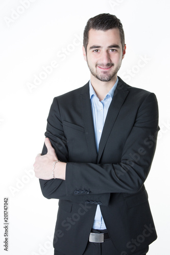 Handsome smiling confident businessman portrait arms crossed