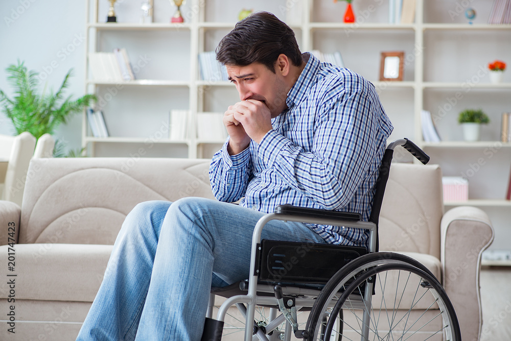 Disabled young man suffering at home Disabled young man suffering at home