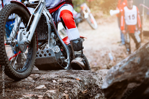 Trials motorcycle while competition in nature park, close up shot