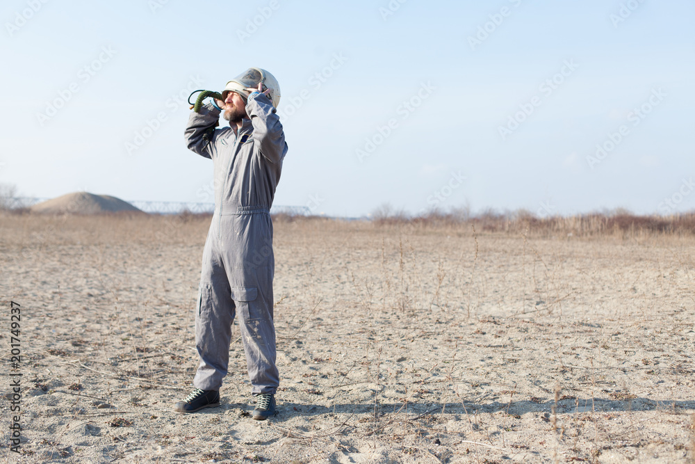 Fototapeta premium combat pilot waiting for rescue in desert area