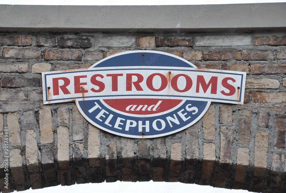 Obraz premium Restrooms and telephones signs