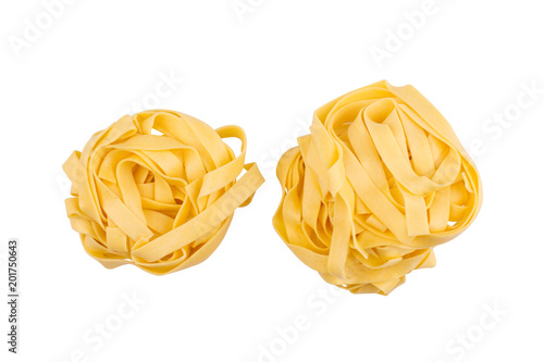 two balls of tagliatelle pasta isolated on white photo