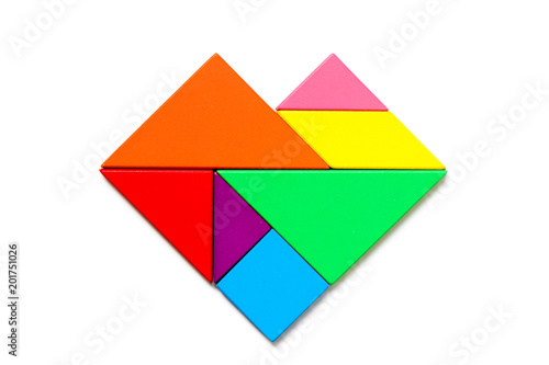 Color wood tangram puzzle in heart shape on white background