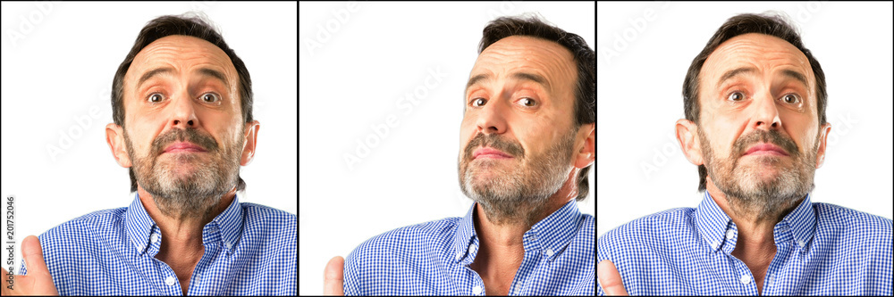 Middle age handsome man closeup doubt expression, confuse and wonder concept, uncertain future Middle age handsome man closeup doubt expression, confuse and wonder concept, uncertain future