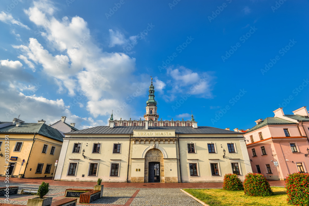 Zamosc, Poland - August 23, 2017: Beautiful ancient Town Hall of Zamosc and bright blue sky.  Town Zamosc is  UNESCO World Heritage List site.