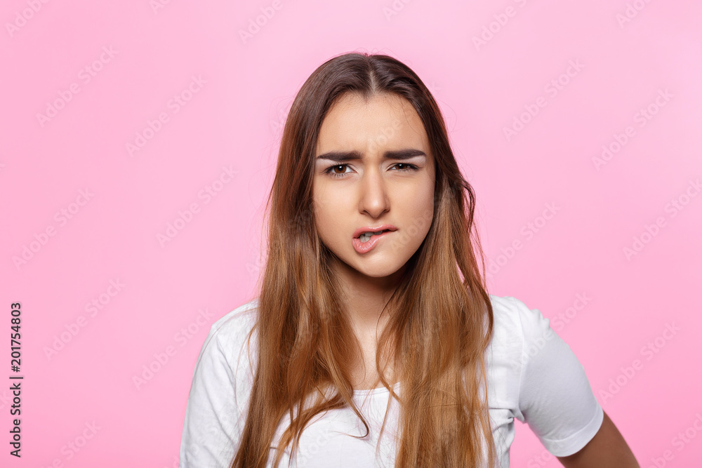 doubtful looking beautiful young brunette. Attractive beautiful woman showing air kiss doubtful looking beautiful young brunette. Attractive beautiful woman showing air kiss