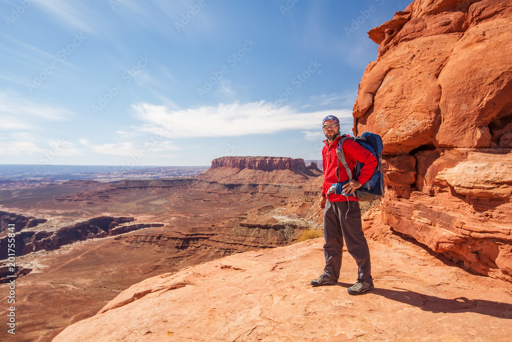 Hiker in Canyonlands National park in Utah, USA Hiker in Canyonlands National park in Utah, USA