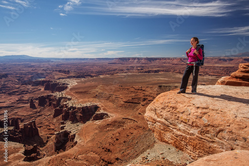 Hiker rests in Canyonlands National park in Utah, USA