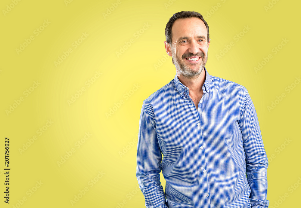 Handsome middle age man confident and happy with a big natural smile laughing Handsome middle age man confident and happy with a big natural smile laughing