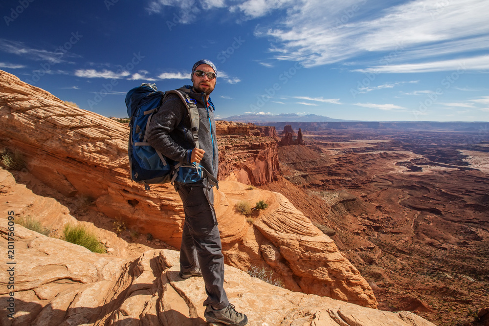Hiker in Canyonlands National park in Utah, USA Hiker in Canyonlands National park in Utah, USA