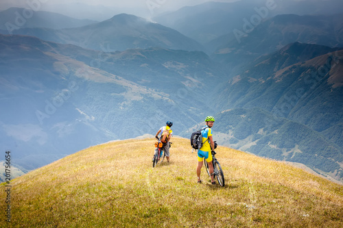 Cyclists rest in the mountains while biking