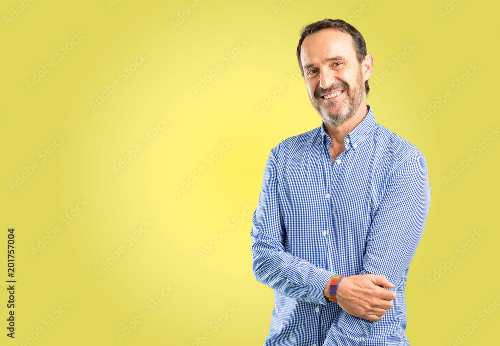 Handsome middle age man confident and happy with a big natural smile laughing Handsome middle age man confident and happy with a big natural smile laughing