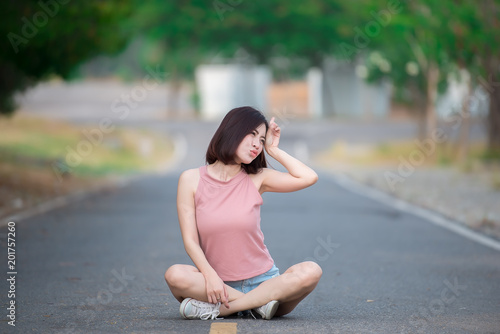 Portrait of asian woman sit on the road,Beautiful thailand people,Happy woman concept,Lifestyle of modern girl
