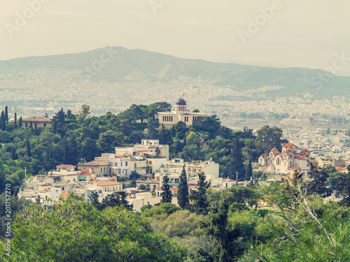 Athens, Greece, 03.03.2018: View of Athens city with Lycabettus hill in the background. view of Athens city with Plaka neighborhood © flowertiare