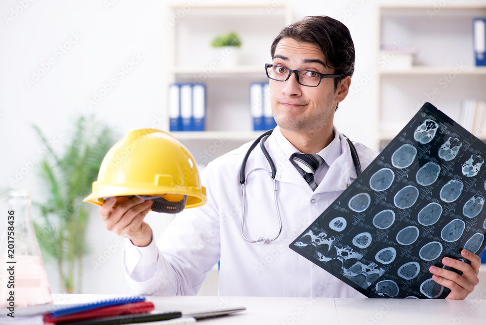 Safety doctor advising about wearing hard hat Safety doctor advising about wearing hard hat