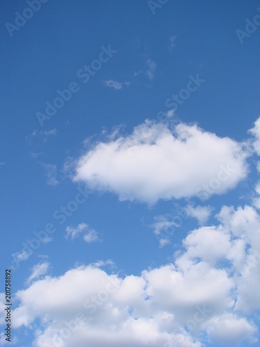 clear blue sky with plain white cloud with space for text background.