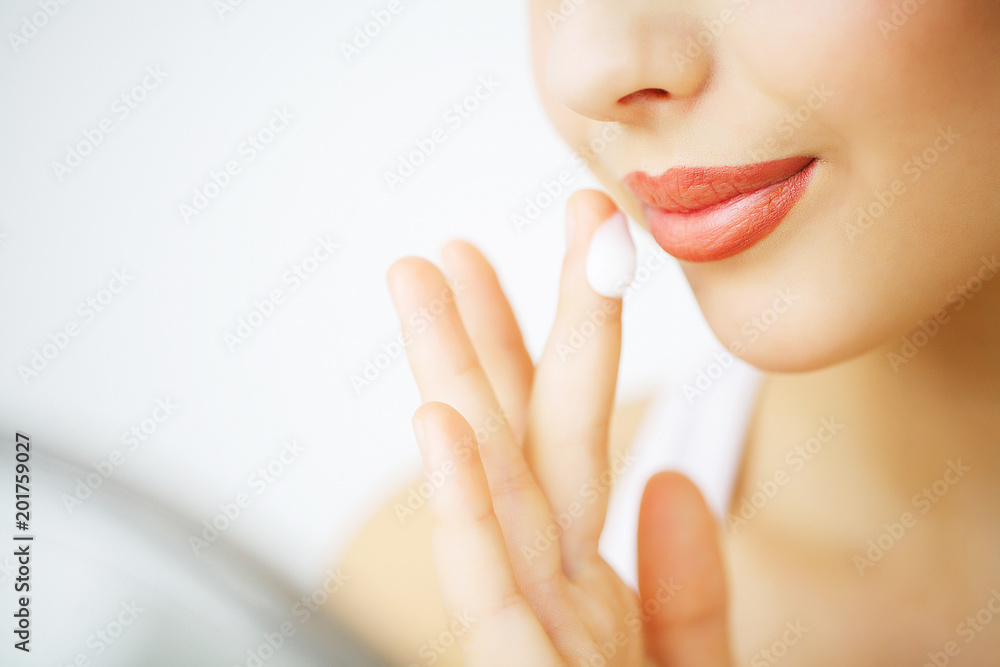 Beauty Face Care. Woman Applying Cream On Skin. Beauty Face Care. Woman Applying Cream On Skin.