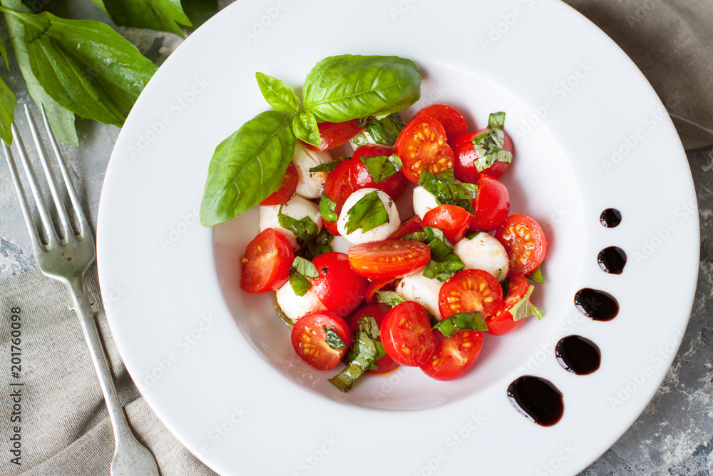Mozzarella, cherry tomatoes and basil salad Mozzarella, cherry tomatoes and basil salad