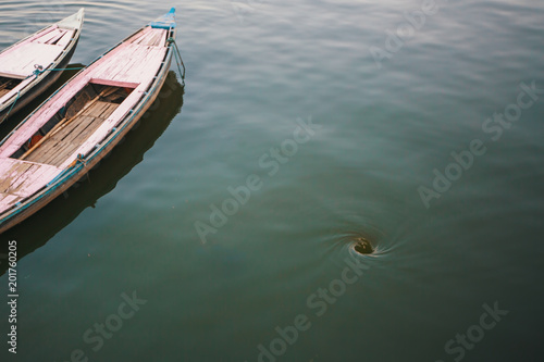 Funnel whirlpool in the water of the Ganges river in Varanasi, India.