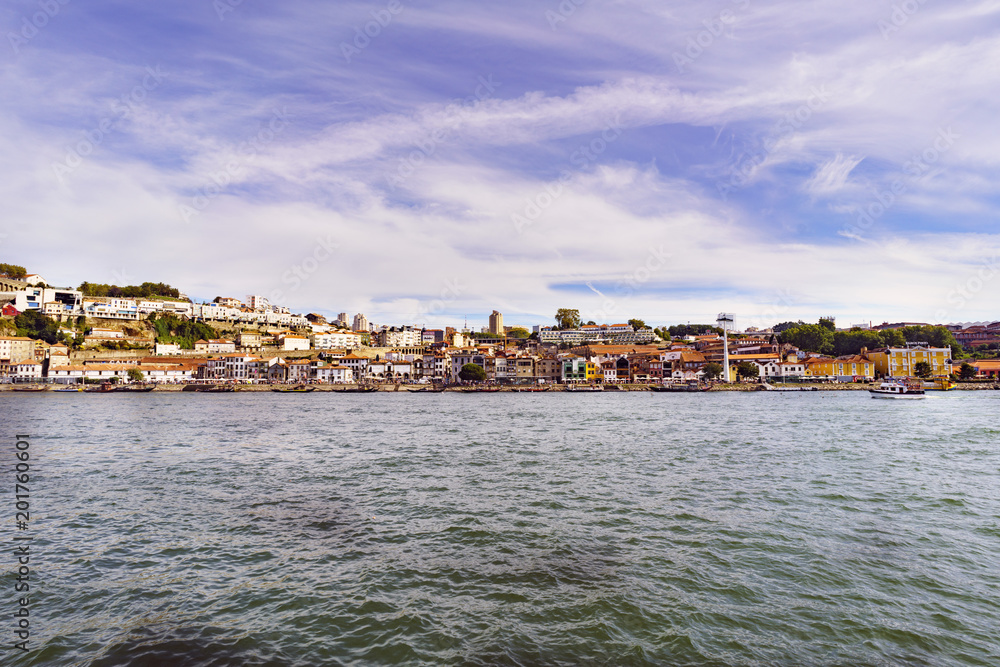 Porto, Portugal. August 12, 2017: panoramic view of the south bank of the Douro River estuary with the facades of the wineries that are on its shores