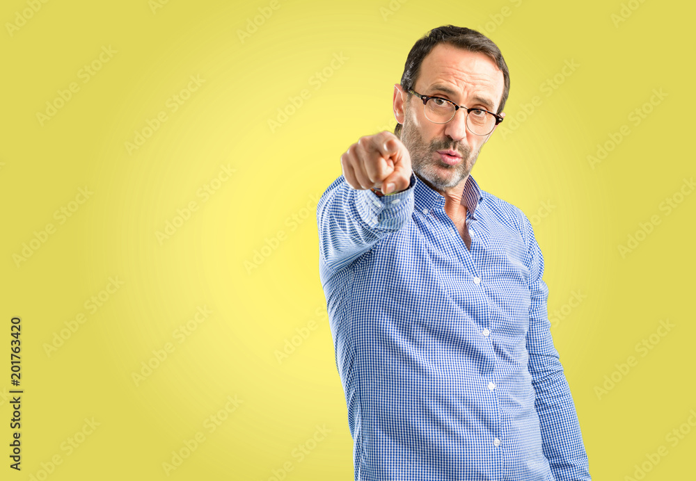 © Krakenimages.com - Handsome middle age man pointing to the front with finger