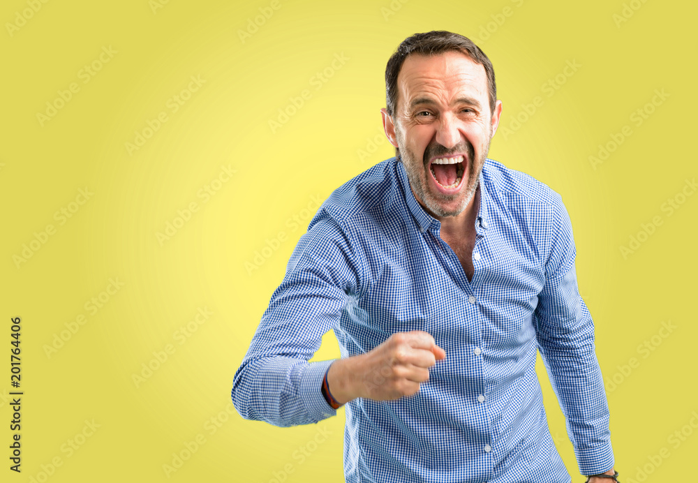 Handsome middle age man irritated and angry expressing negative emotion, annoyed with someone Handsome middle age man irritated and angry expressing negative emotion, annoyed with someone