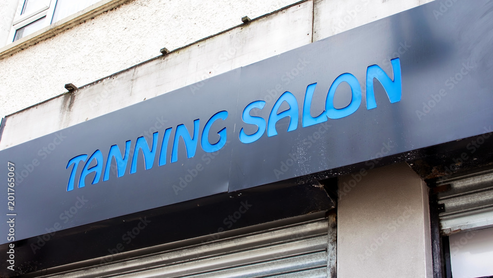 Tanning Salon shopfront sign.