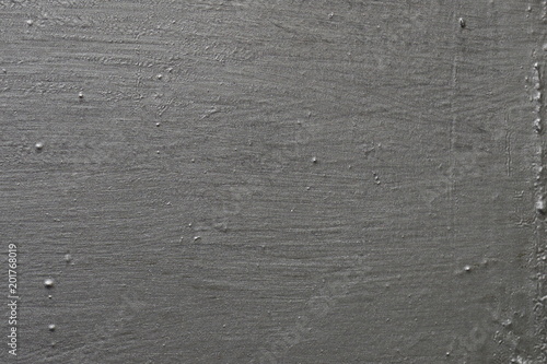 The surface is painted with gray paint.