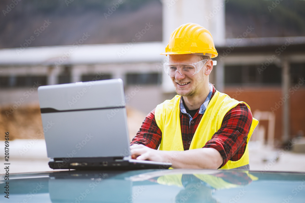 Construction Worker Using Laptop Construction Worker Using Laptop