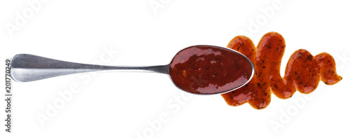 Salsa sauce with spoon isolated on white background. Top view