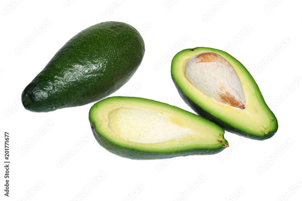 Two avocado, the whole and cut in half with bone on white background, isolated Two avocado, the whole and cut in half with bone on white background, isolated