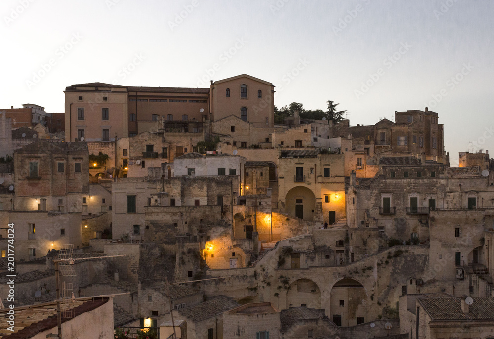 View at sunset of historic buildings in the city center of Matera City, Italy