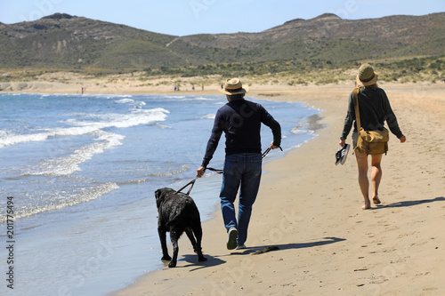 pareja con perro paseando por la playa de genoveses almería 4M0A1513-f18 photo