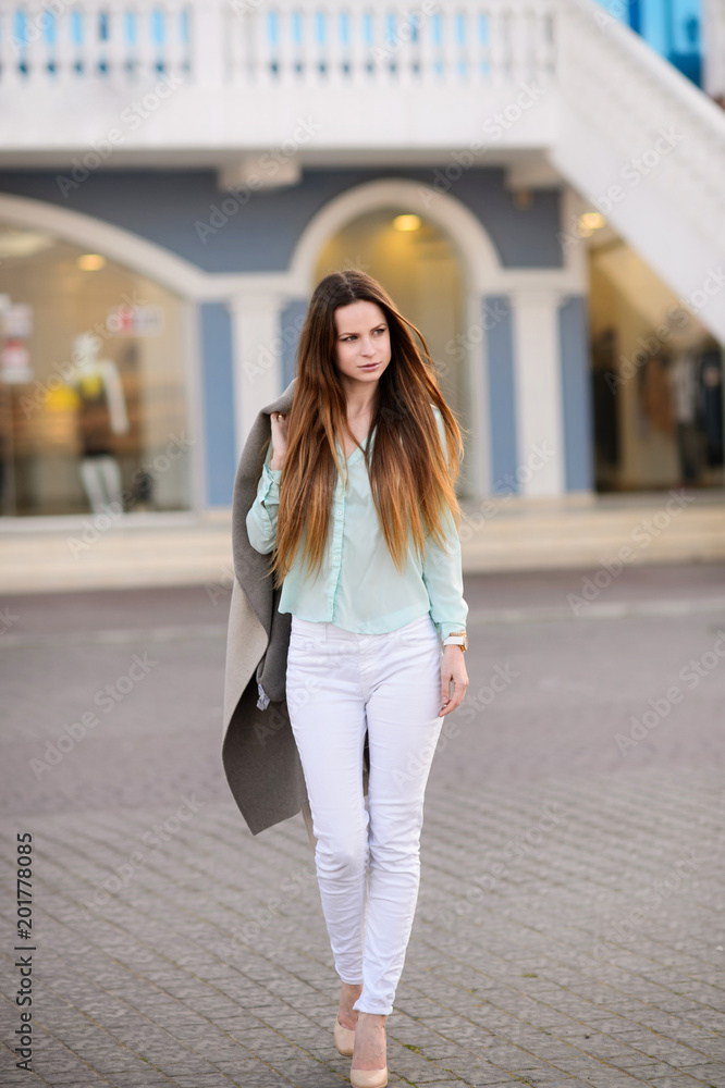 Beautiful girl in spring sunny day outdoors