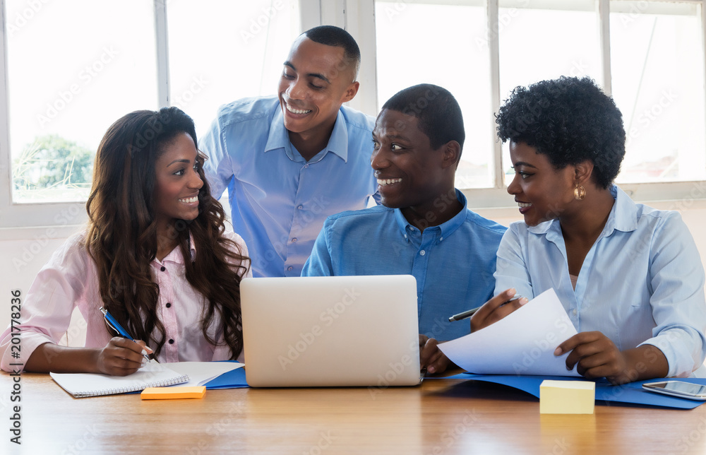 Laughing african american businessmen and businesswoman Laughing african american businessmen and businesswoman
