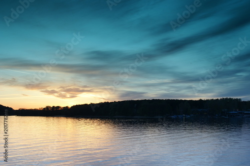 Zachód słońca nad jeziorem. Olsztyn nocą. Polska - Mazury - Warmia.  photo