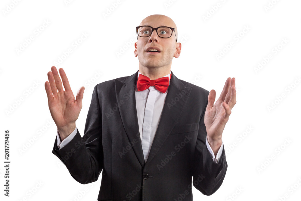 Slim bald elegant nerd with glasses and bow tie looking at the camera with the gesture of astonishment. Isolated on white. Slim bald elegant nerd with glasses and bow tie looking at the camera with the gesture of astonishment. Isolated on white.