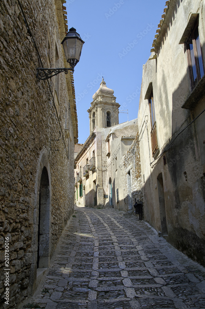 The steep stone street in the old historic village of Erice in Sicily, Italy