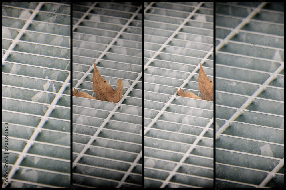 Square metal hatch in urban pavement, sewer manhole cover with marking lines and leaf inside Square metal hatch in urban pavement, sewer manhole cover with marking lines and leaf inside