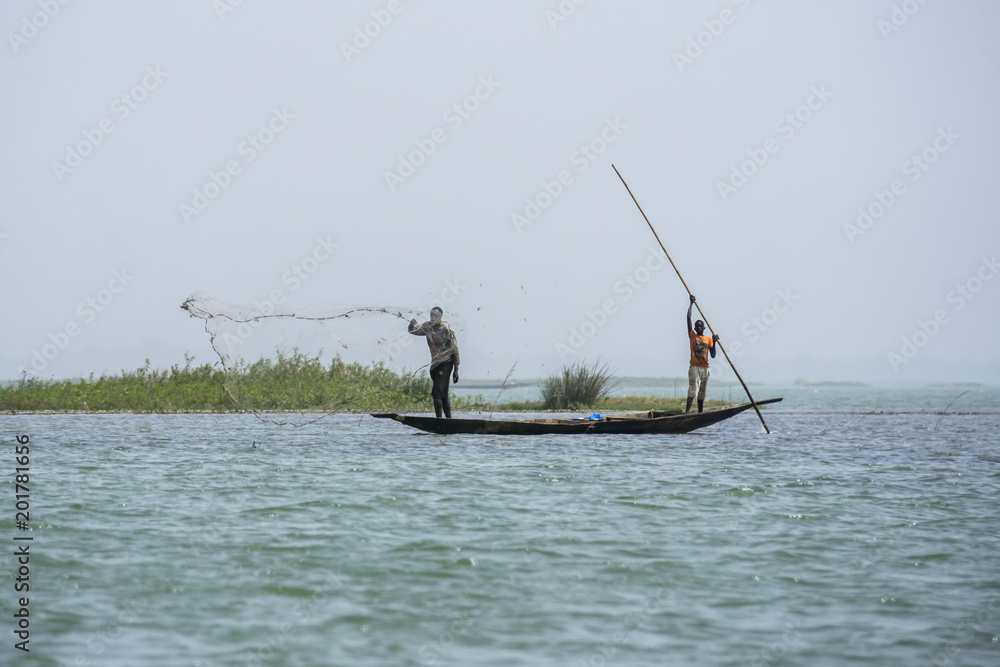 Fishing from wooden canoes on the Niger river, Mali
