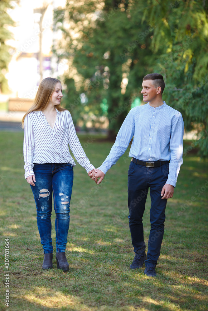 Couple walking in the park enjoying time together. Couple walking in the park enjoying time together.