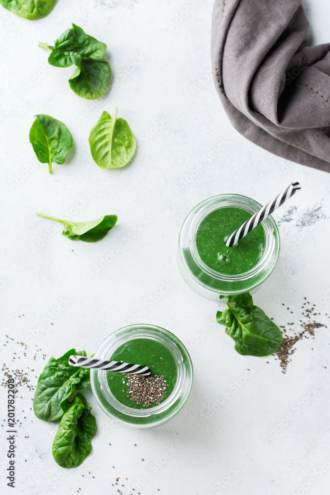 Healthy green vegan smoothie with spinach, spirulina and chia seeds Healthy green vegan smoothie with spinach, spirulina and chia seeds