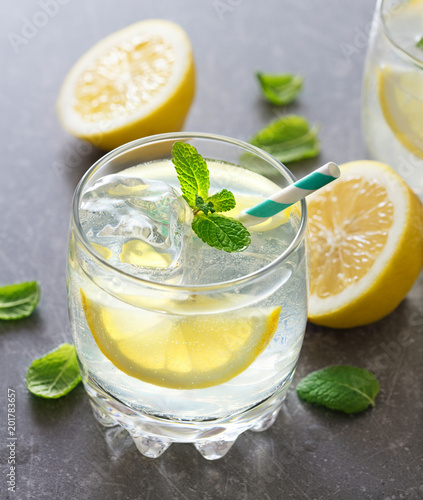 two glasses of lemonide with lemon and mint leaves