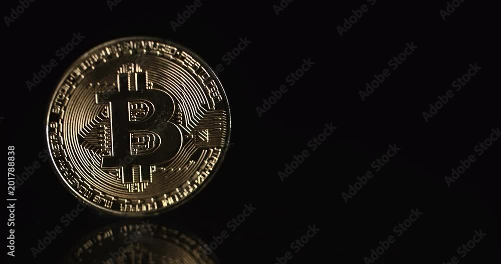 Slide Shot Of Crypto Currency Bitcoin Coins. Black on Background Slide Shot Of Crypto Currency Bitcoin Coins. Black on Background